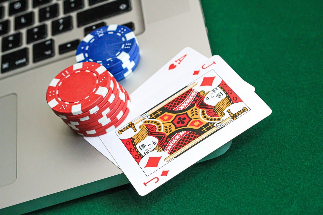 NBA matchup displayed on mobile phone screen with live-casino tables visible in the background